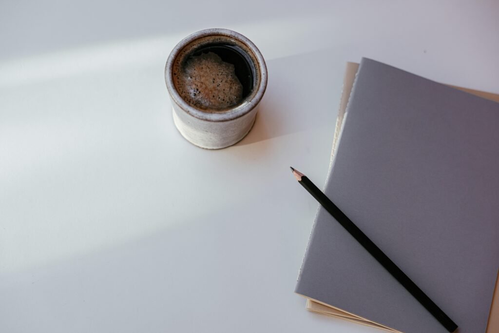 A clean minimalist desk representing the Dani Jacob Part323 lifestyle and high ticket crm for small business freedom.
