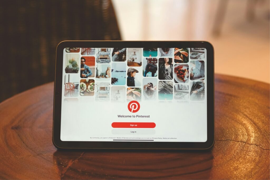 A tablet displaying aesthetic Pinterest pins that drive viral traffic to a blog about affiliate marketing for introverts.