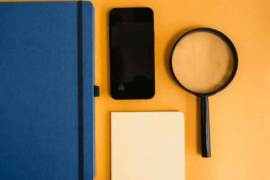 A clean and minimalist desk with a single smartphone, representing the Dani Jacob brand and the Part 330 mobile-first philosophy.