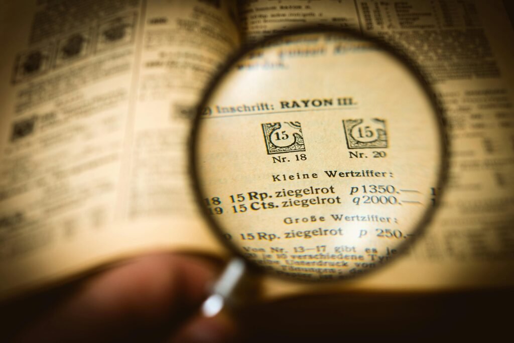 A magnifying glass over a digital license agreement for free digital products resell rights.