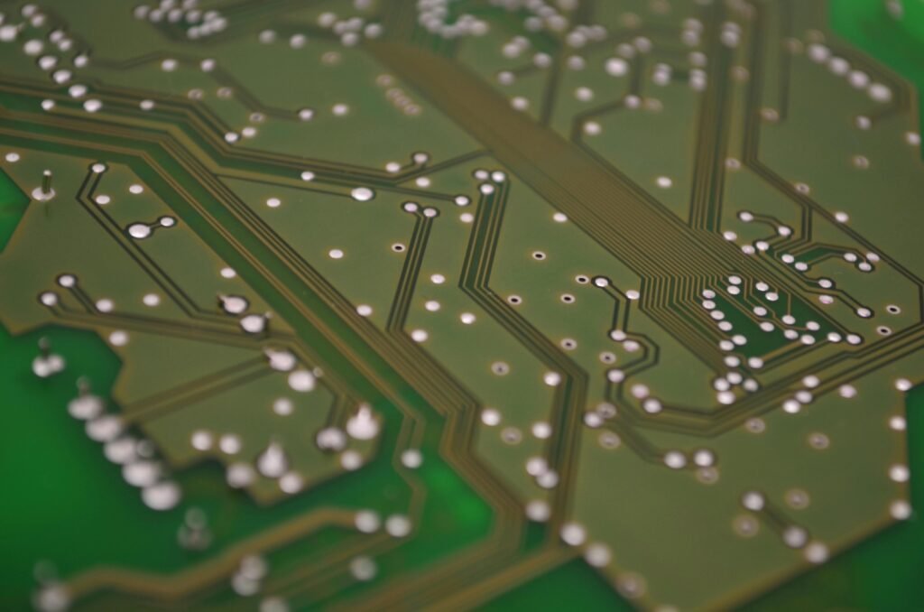 A close-up of a digital circuit board representing the "Backend Brain" when you sell no-code database templates.