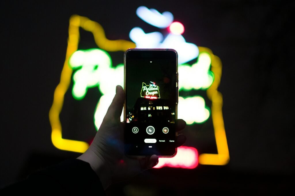 A high-quality close up of a hand holding a smartphone with glowing digital elements representing the real use of affiliate marketing apps for android on danijacob.com.